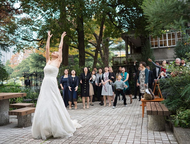 Bride throwing bouquet - wedding vovcabulary